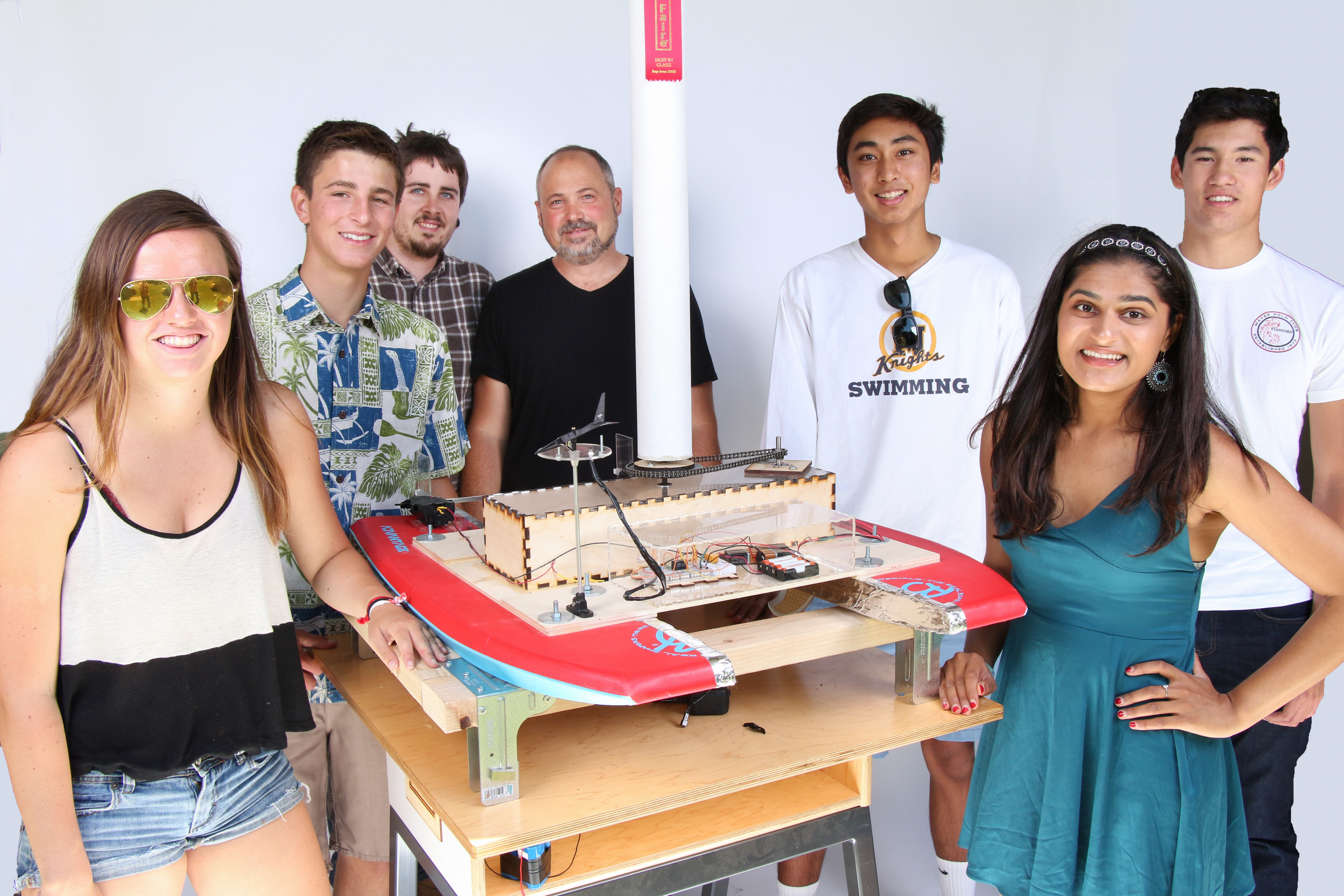 Posing for a portrait on the last day of school. Photo by Pete Zivkov. Magnus-effect catamaran by Menlo School Applied Science & Engineering. Photo by Pete Zivkov.